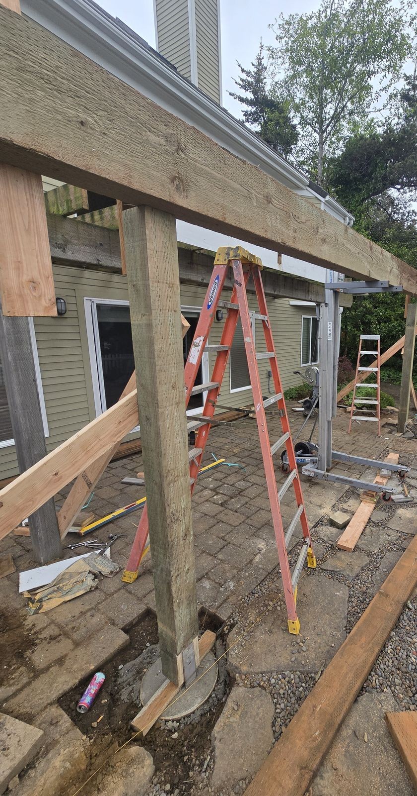 Deck beam-and-post framing in progress